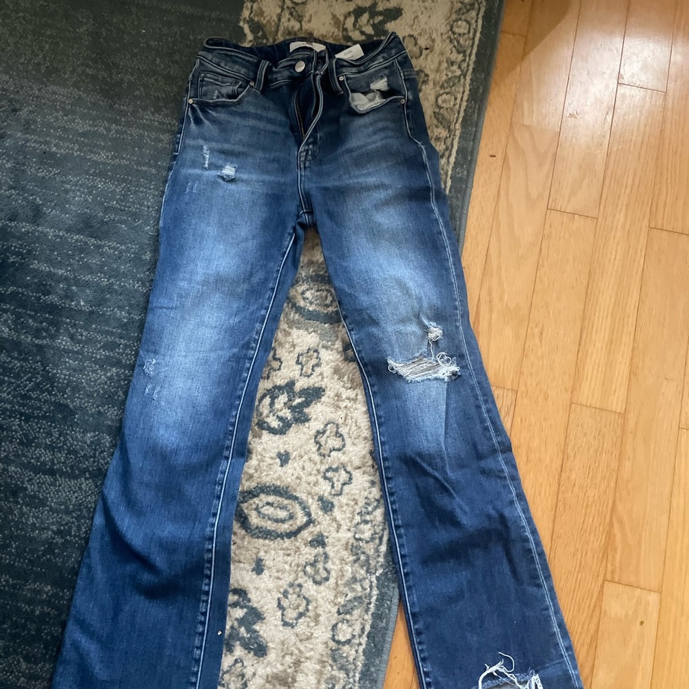 Size 28 risen jeans.
